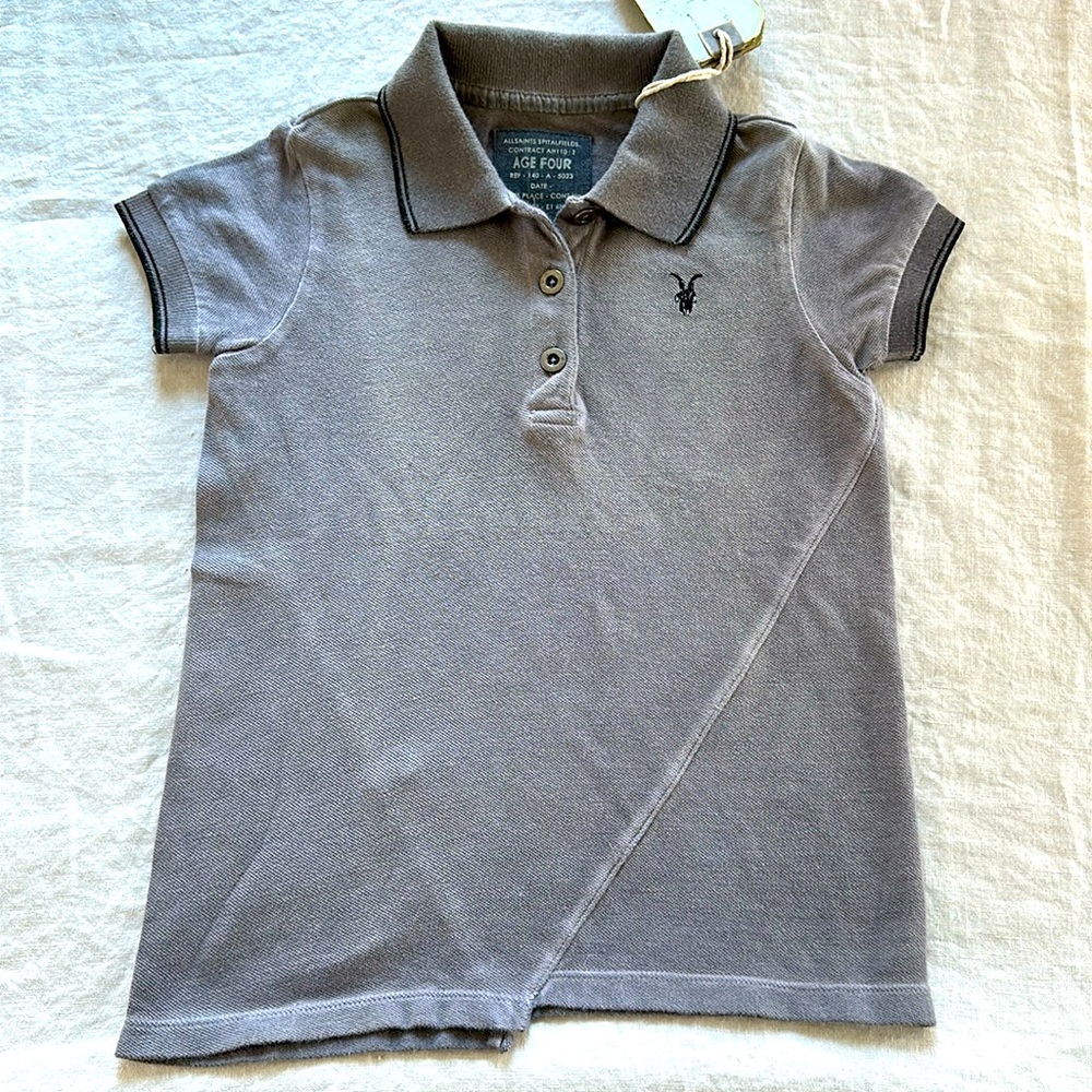 All Saints Spitalfield Boys Age 4 Iconic Asymmetrical Pique Polo,Ramskull symbol